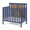 Connelly - Mini Crib With Mattress Pad Midnight - Blue / Vintage Walnut - Image 2
