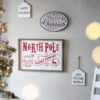 Iron / Wood North Pole Trading Company Wall Sign, For Christmas Holiday Table Wall Decor - White / Red - Image 2