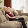 Modern 2 Seater Sofa With Ottoman And Round Bolster Armrests - Camel - Image 5
